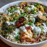 Roasted Brassica Bowl featuring crisp-tender vegetables, toasted pumpkin seeds, and fresh parsley on a bed of hearty grains.