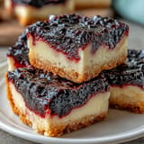 Vibrant blackberry lemon bars with buttery shortbread, perfect for dessert.
